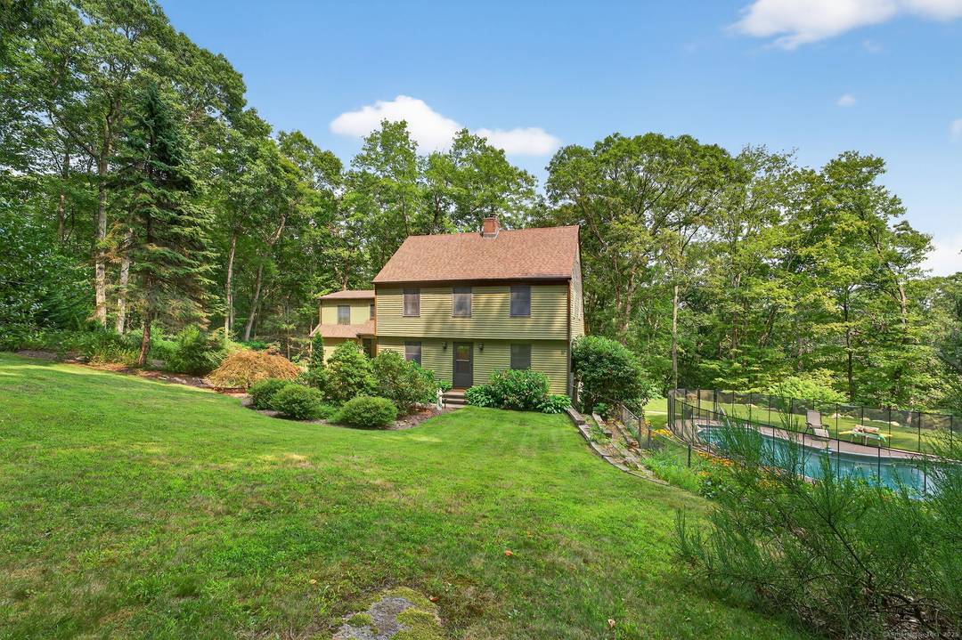 PRICE REDUCTION ! ! ! Tucked away on a private, wooded 1.