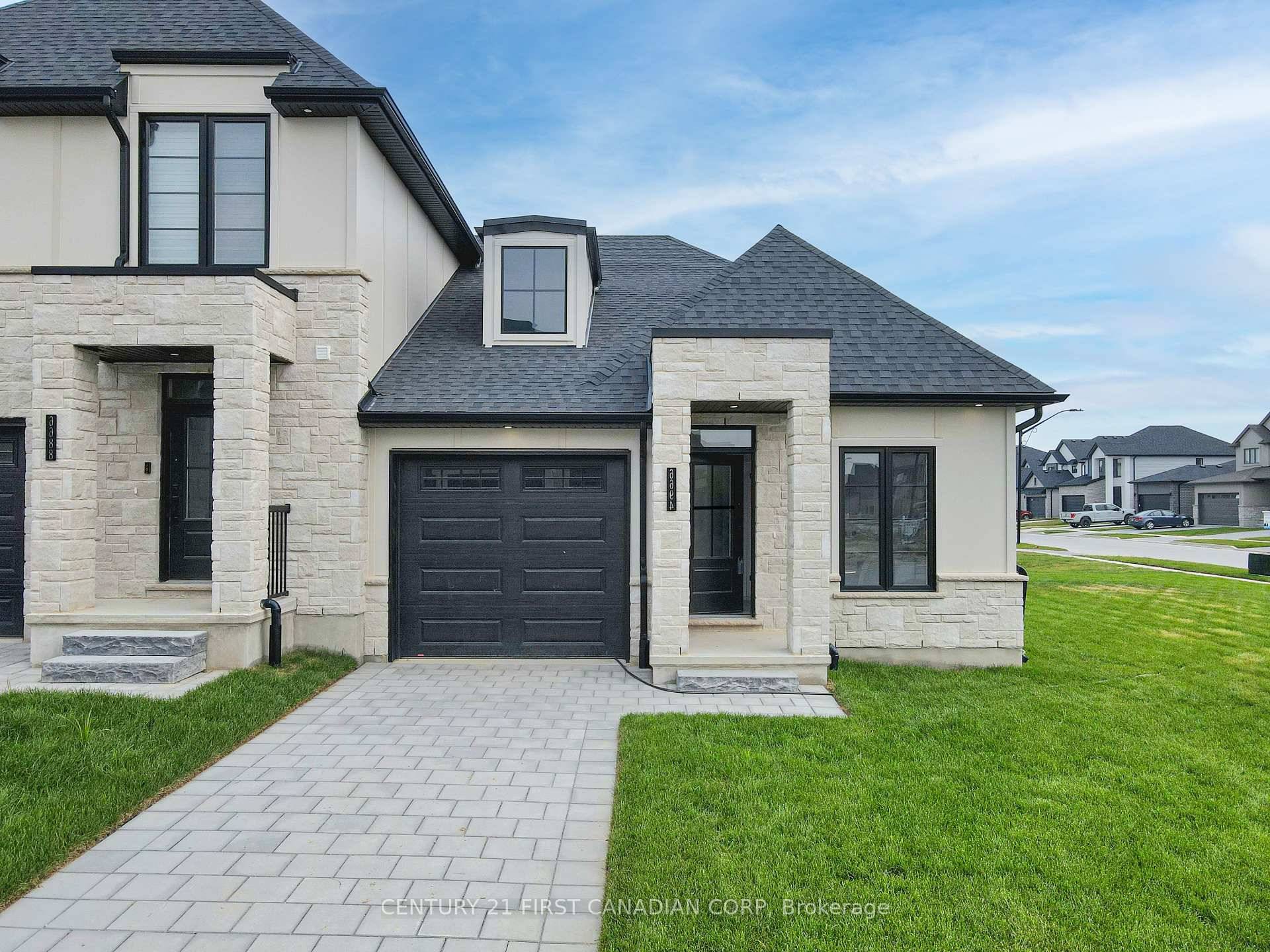 MOVE IN READY FREEHOLD BUNGALOW TOWNHOME This end unit 2 Bed, 2 Full Bath executive layout bookends the townblock, providing a Grand, Award Winning road appeal.