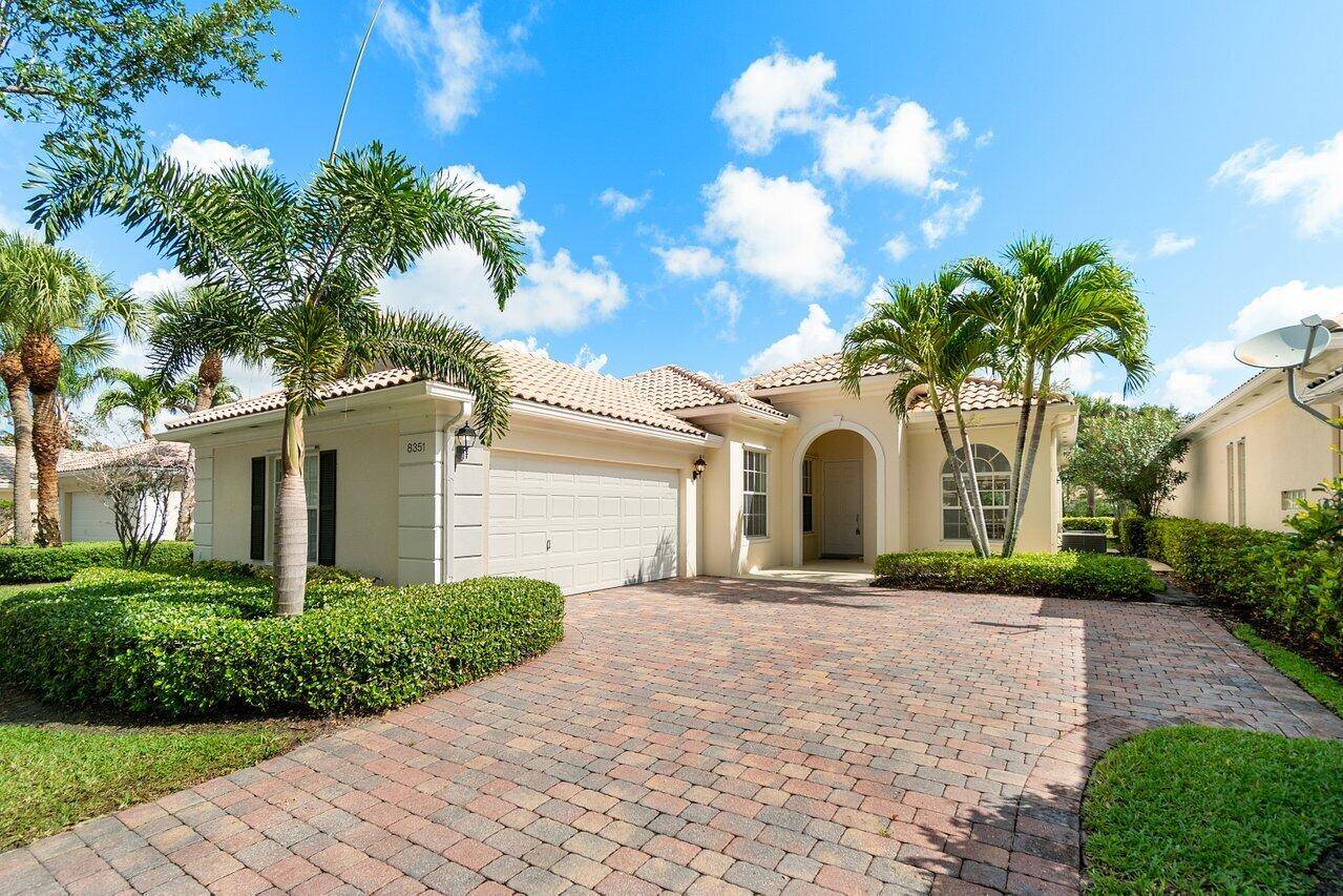 Freshly painted and filled with natural light, this 3 bedroom, 2 bath den Oakmont model home in VillageWalk offers a spacious, split bedroom layout and peaceful lake views.
