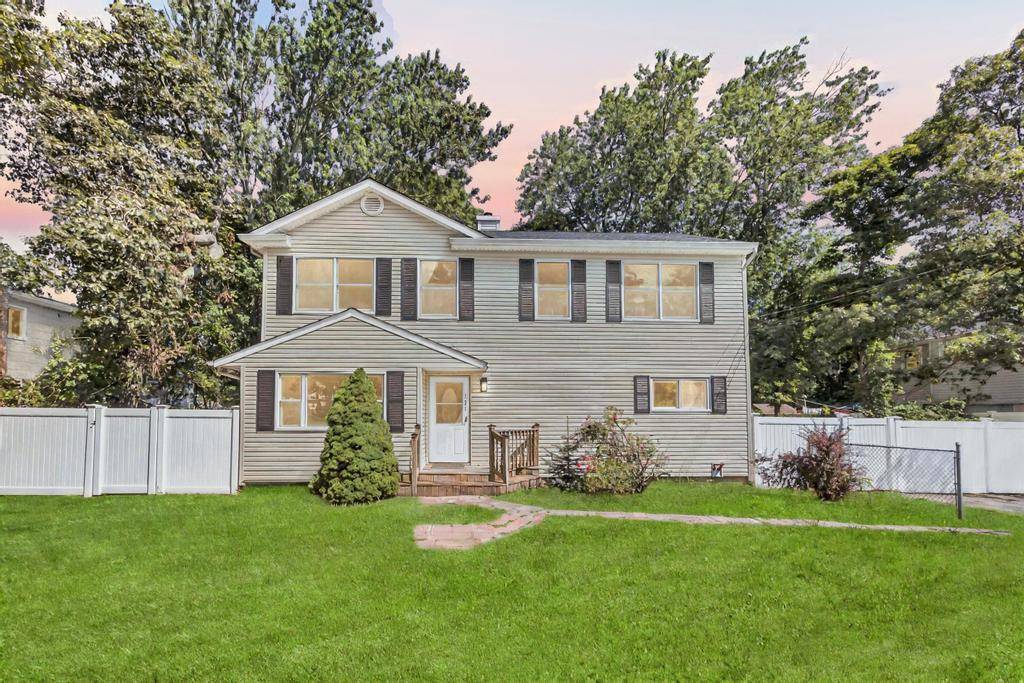 Welcome to this beautifully renovated Colonial featuring 4 bedrooms and 2 modern bathrooms.