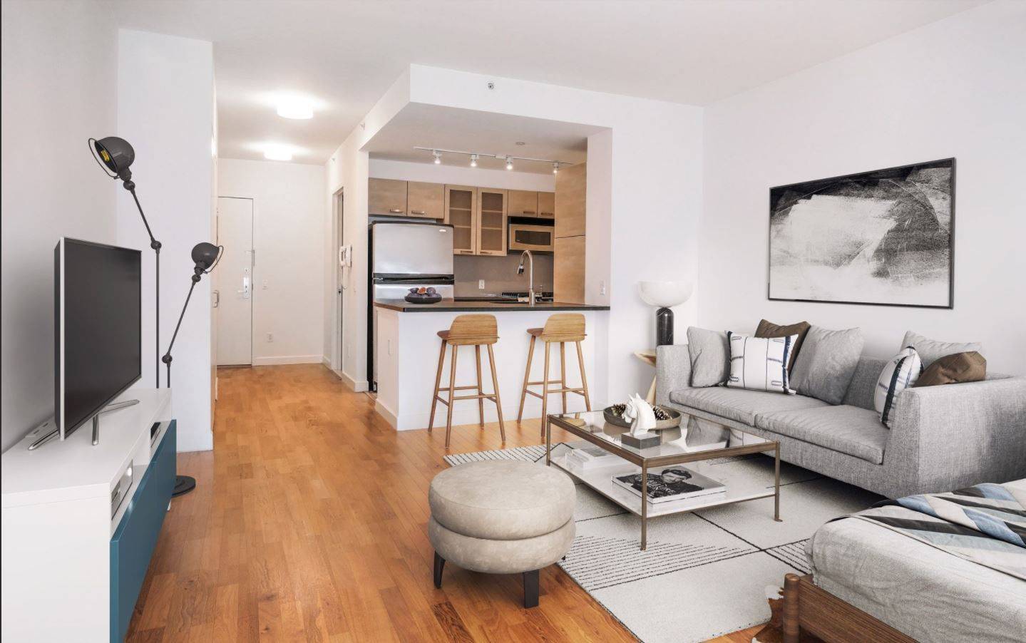 Oversized studio apartment featuring floor to ceiling windows, high ceilings, a gourmet kitchen with stainless steel appliances, honed concrete tile floors, granite countertops and an eating bar.