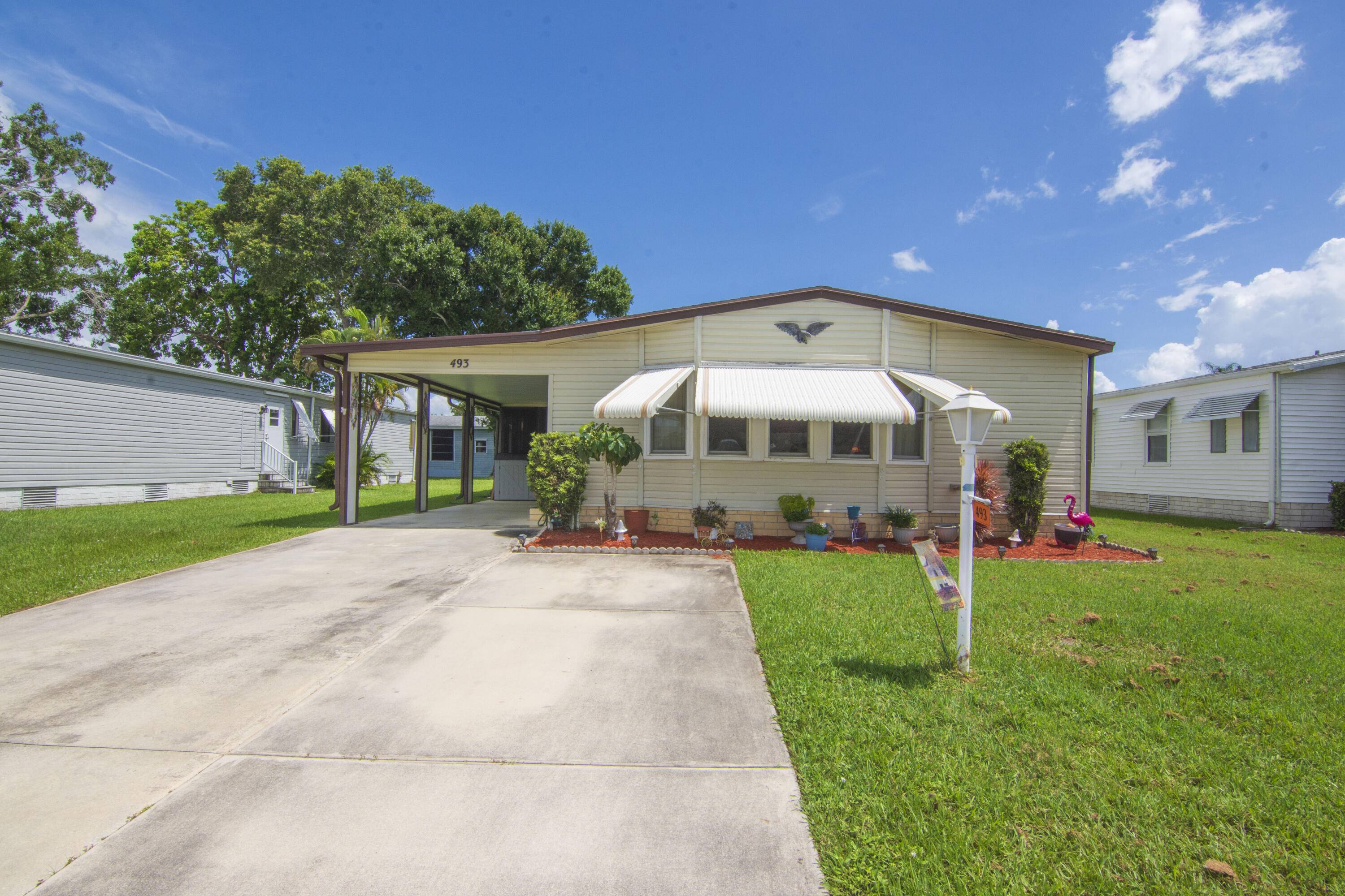 Spacious 2 Bedroom 2 bathroom mobile home located in the desirable 55 community of Tropical Isles.