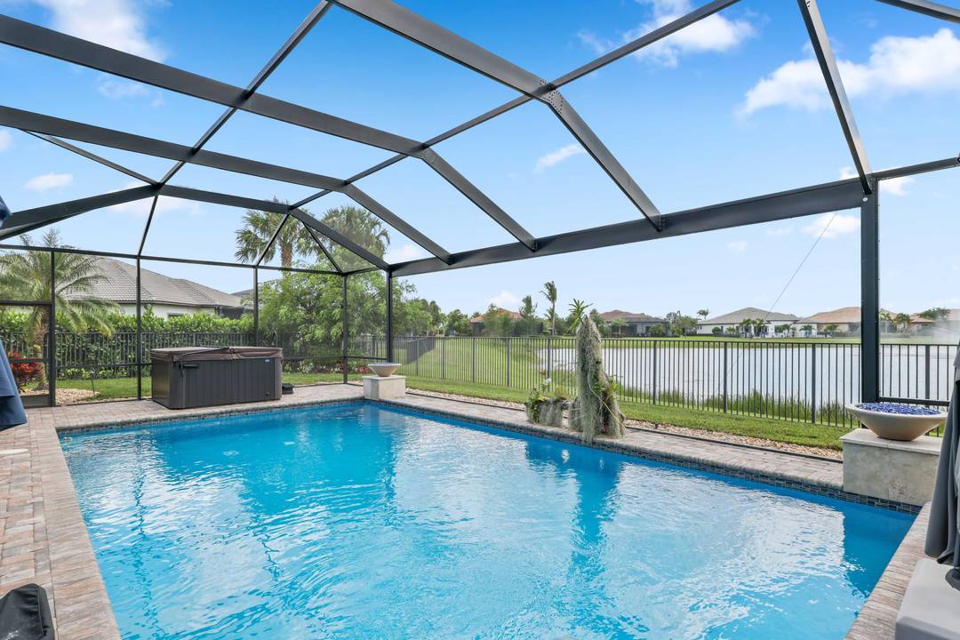 On one of the largest lots in Ancient Tree, this half acre lakefront home offers wide fountain views and a backyard built for enjoyment.