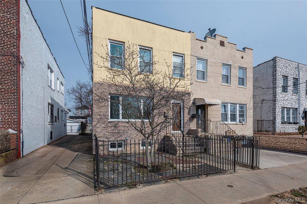 Bright and sunny legal two family home available in Jamaica !