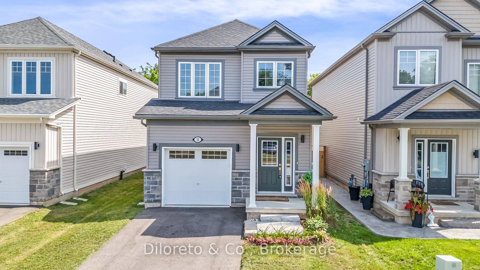 Welcome to 31 Bromley Drive, where modern luxury meets lakeside tranquility in sought after Bromley Gardens.