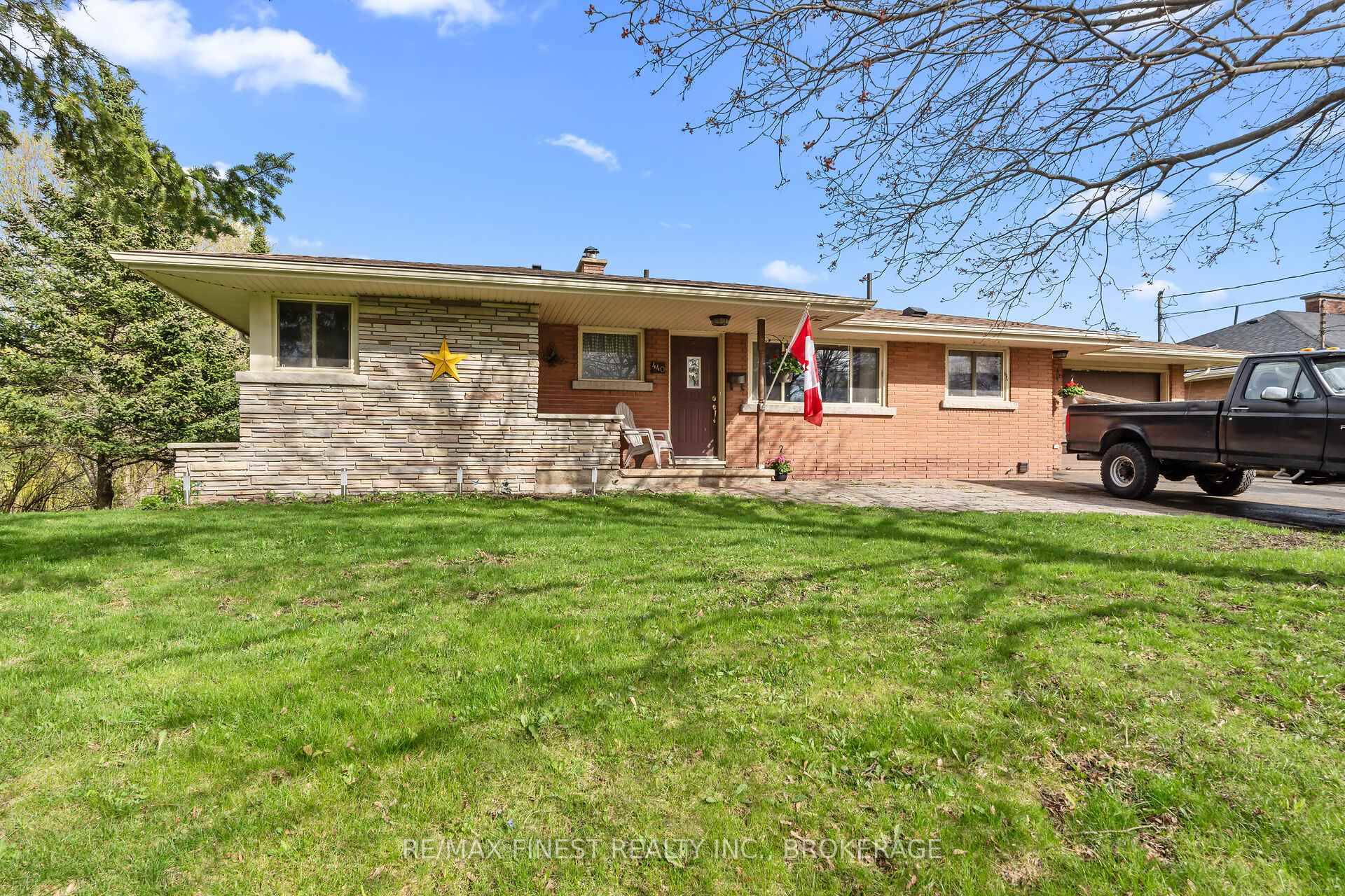 Welcome to this charming all brick and stone bungalow, nestled on a generously sized lot in a desirable neighborhood.