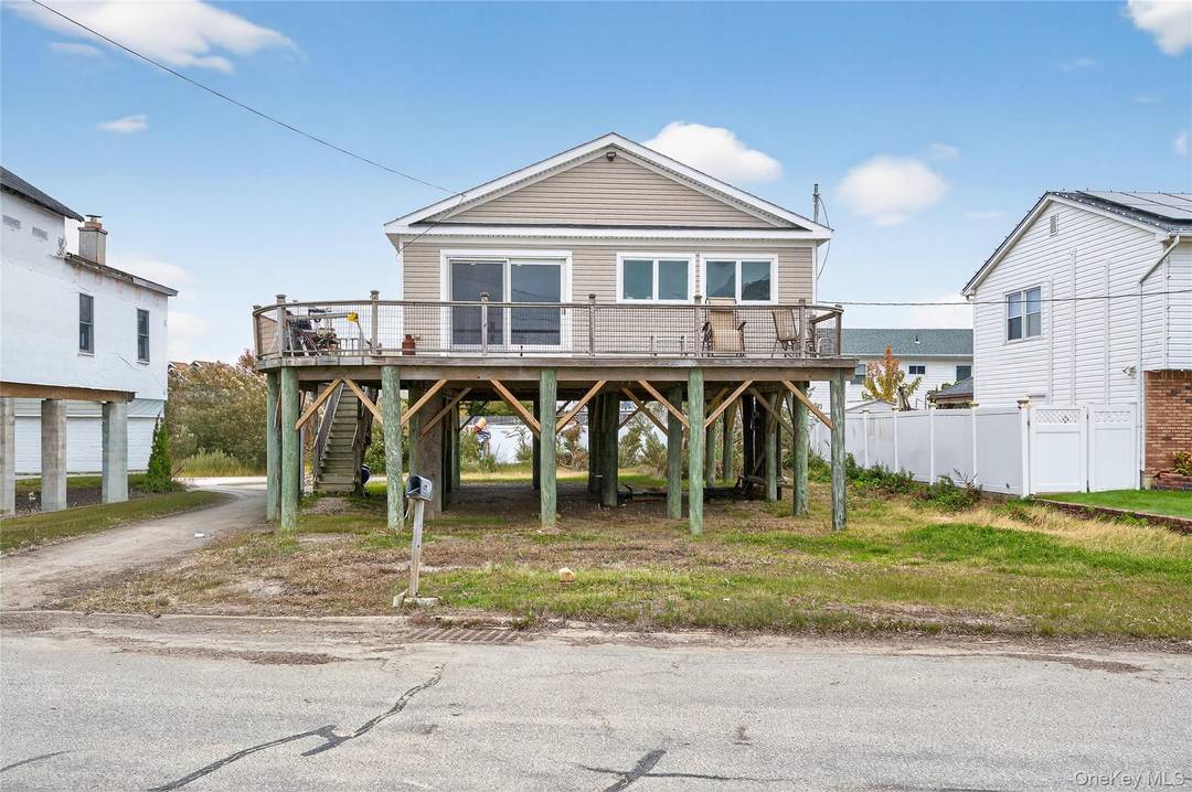 Nestled on a peaceful dead end street, this delightful raised ranch offers breathtaking, unobstructed views of the Great South Bay.
