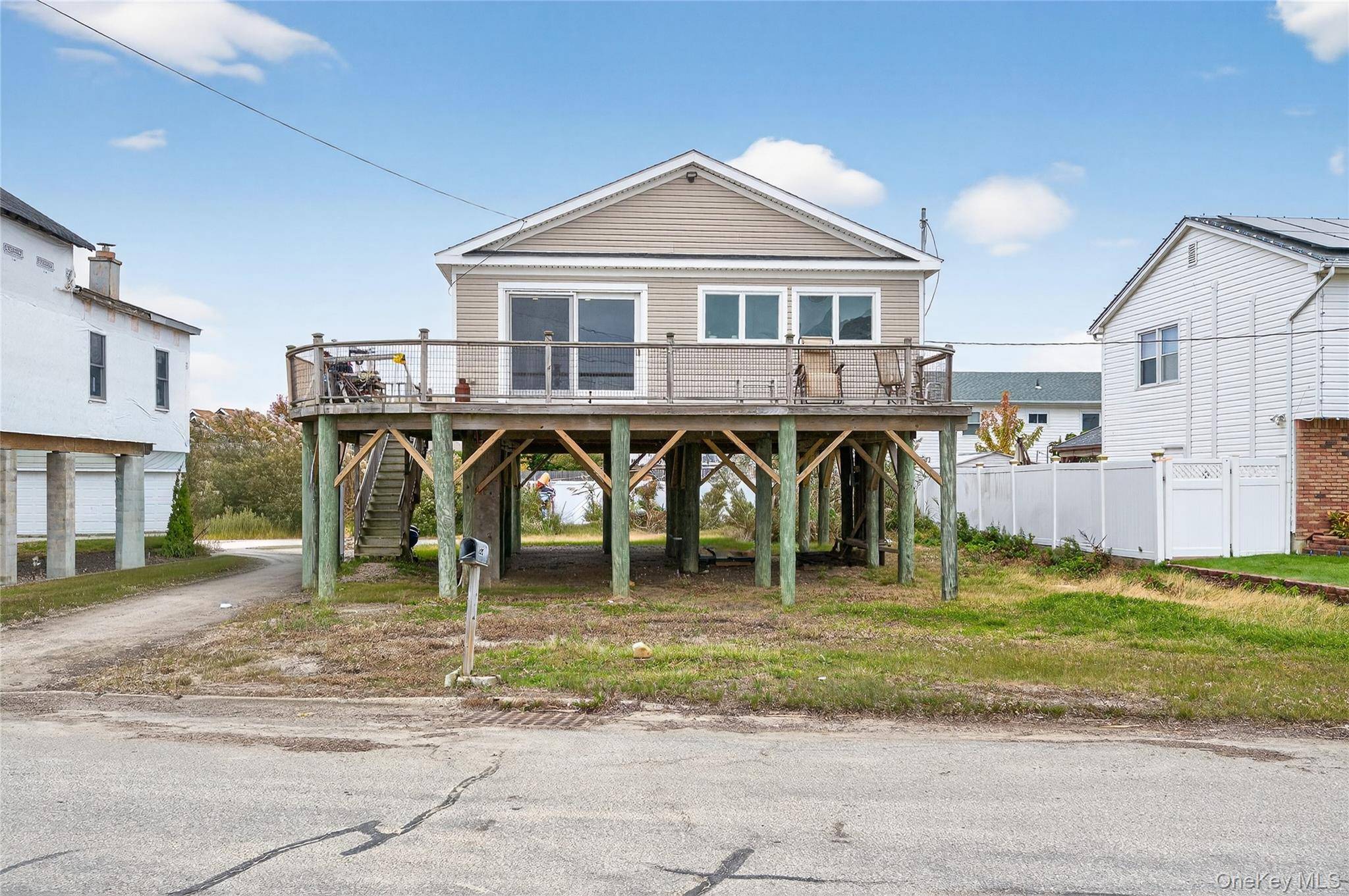 Nestled on a peaceful dead end street, this delightful raised ranch offers breathtaking, unobstructed views of the Great South Bay.