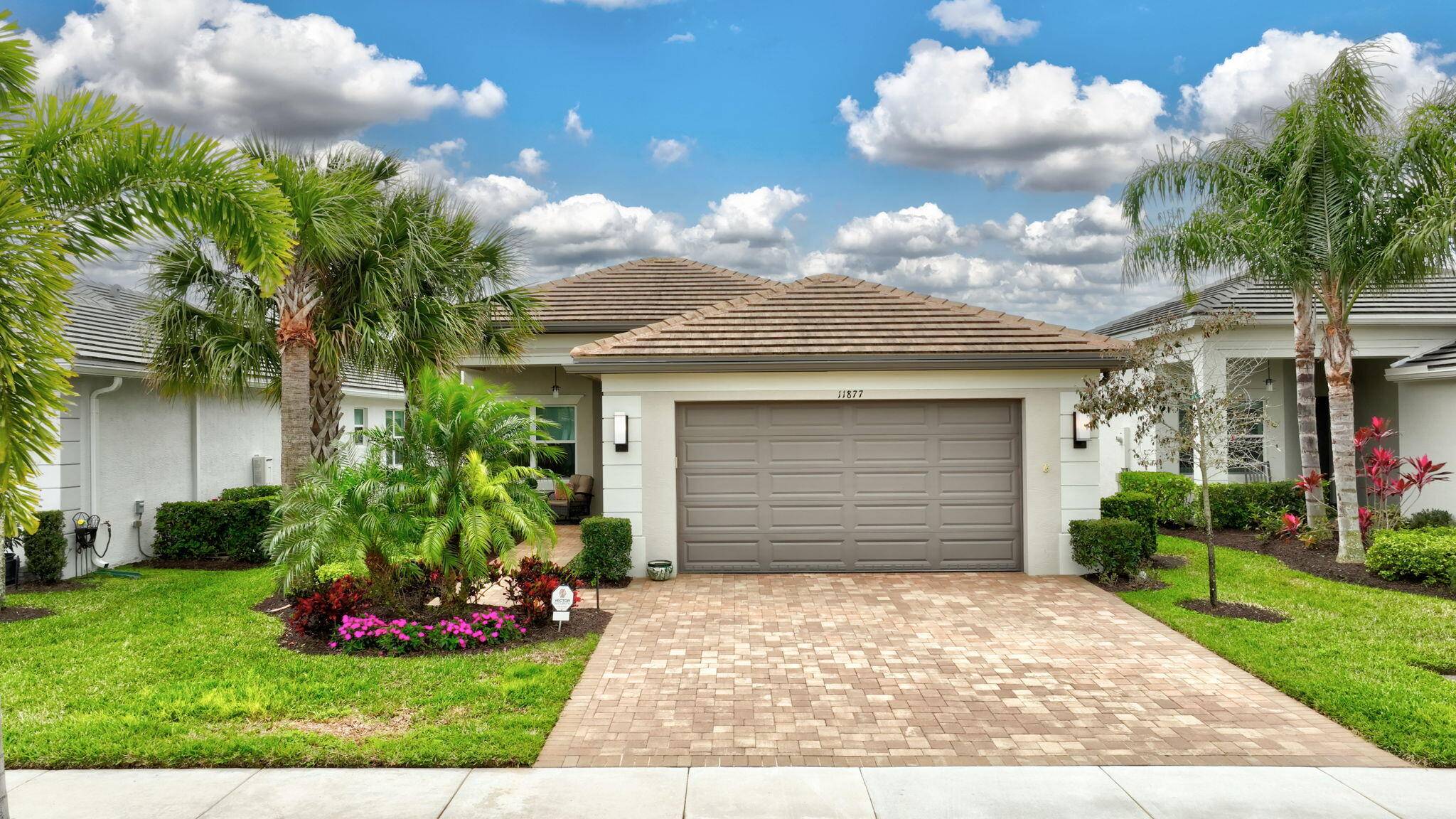 This impeccable Tribeca model is situated on a remarkable lakefront lot in Valencia Cay at Riverland.