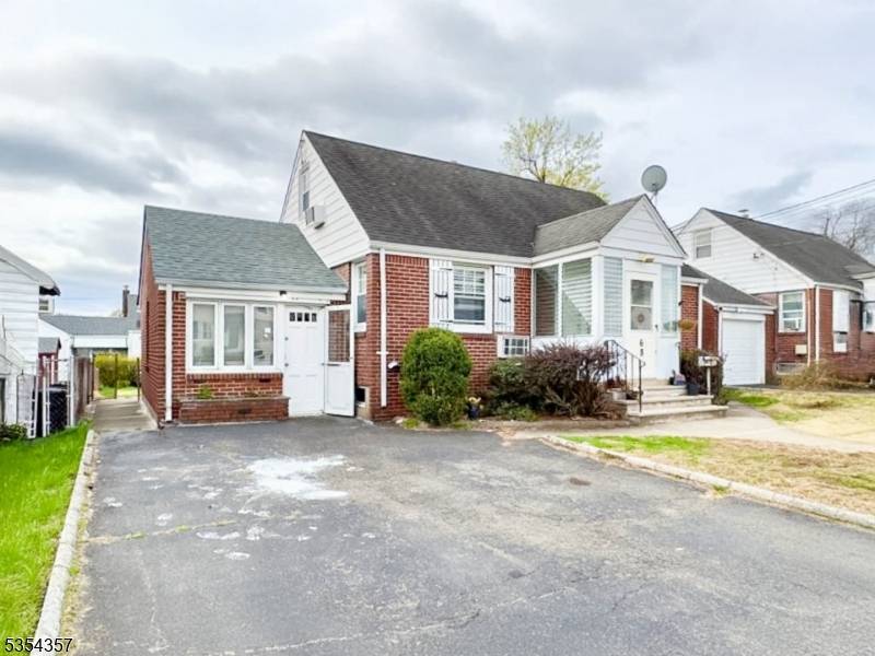 Don't miss your chance to own this charming Cape Cod home in Elmwood Park !