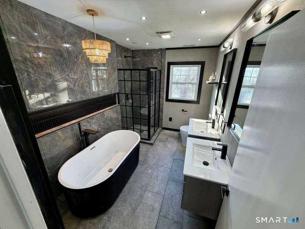 Welcome to a fully reimagined, 1890 square foot turnkey 4 bedroom, 2 bath residence, where every detail has been meticulously updated to deliver modern comfort and timeless elegance.