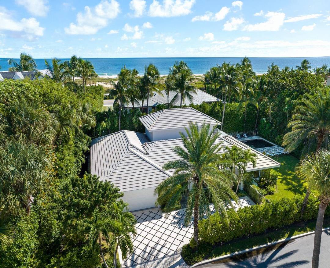 Located on a quiet street in Palm Beach's North End, this modern beach house offers 3, 803 total square feet with four bedrooms and four and a half bathrooms.