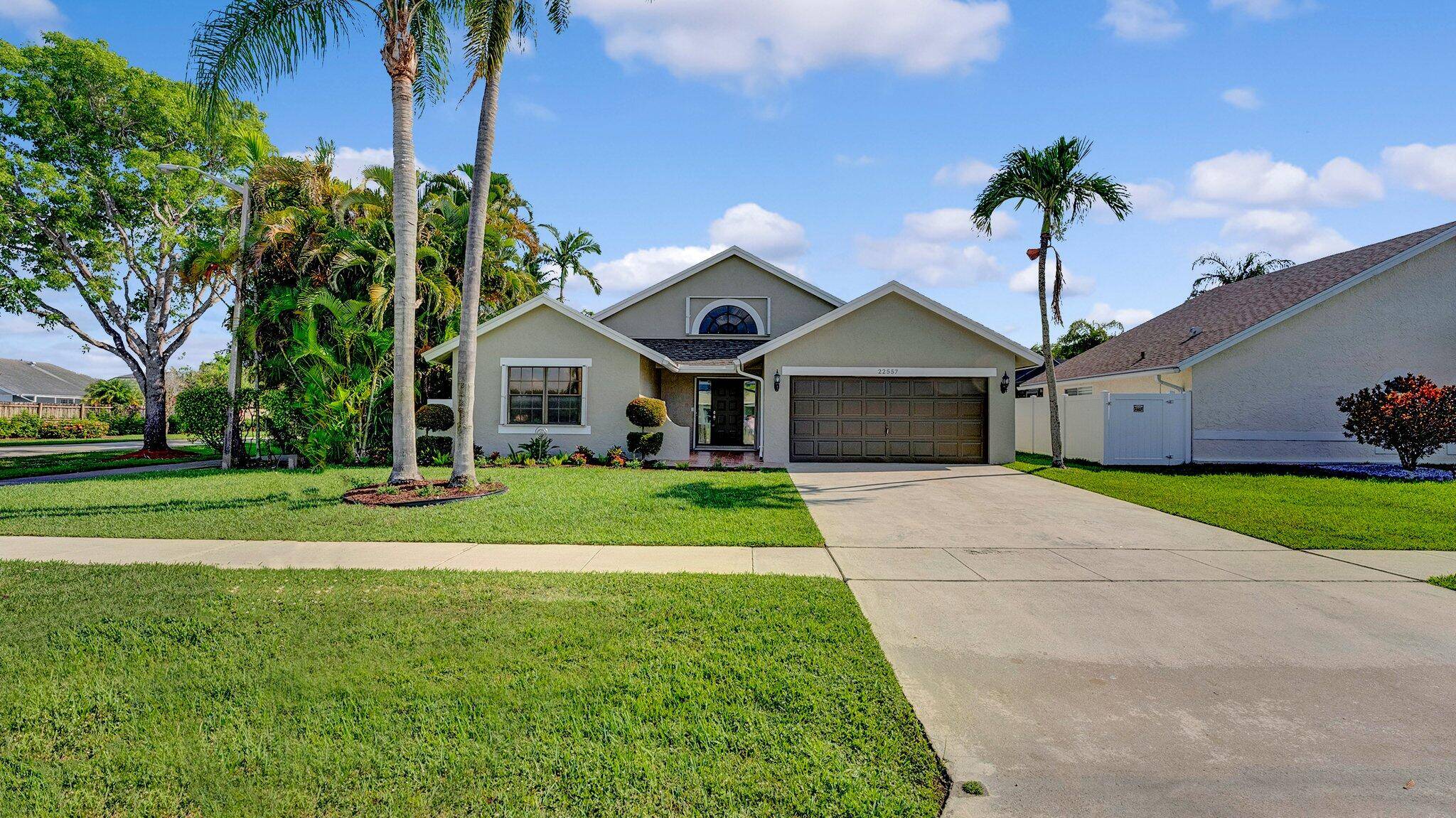 Beautifully remodeled single story family home with long lake views on a spacious corner lot in the desirable Ashley Park In Boca Winds3 Bedrooms 2 Bathrooms2 Car GarageOpen Floor PlanNew ...