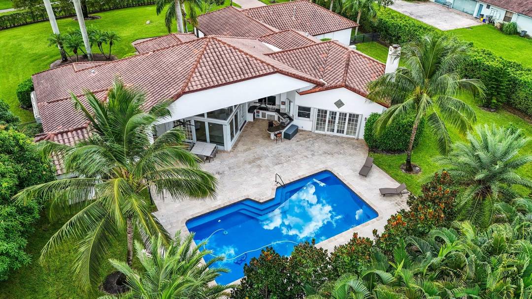Exquisitely Refreshed 5BR 5BA Office Estate Offering Over 5, 198 SF Of Living Space On An Expansive 1 Acre Lot In The Highly Desirable Delray Lakes Estates, Zoned For Top ...