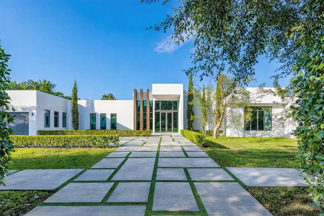 One story modern estate built in 2020 with refined finishes and a clean architectural presence, offering a bright open floorplan framed by oversized windows and doors throughout.