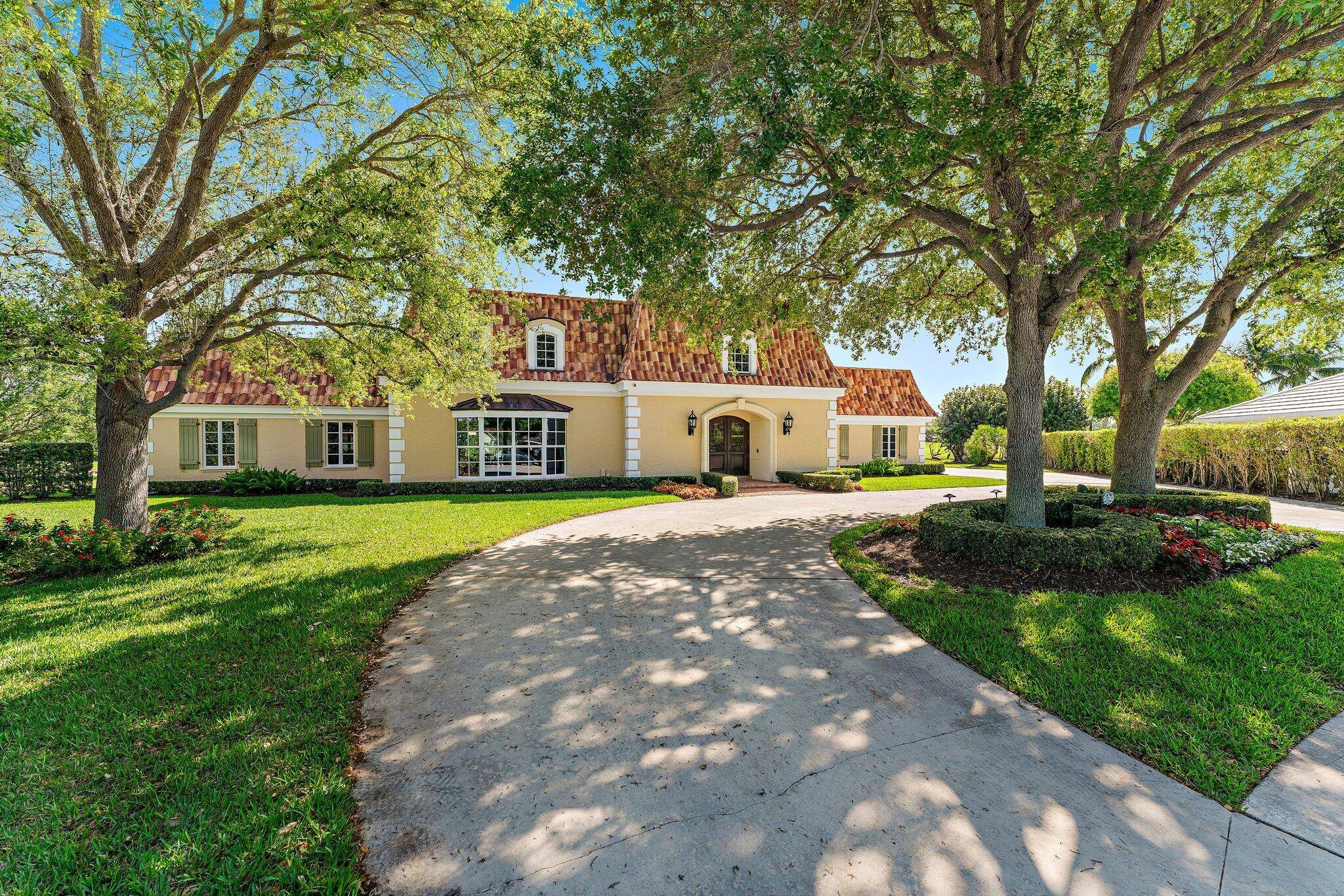 Unprecedented, once in a generation, opportunity awaits in this stately French Country estate home, perfectly positioned on one of the largest golf course and lakefront lots in the entire Village ...