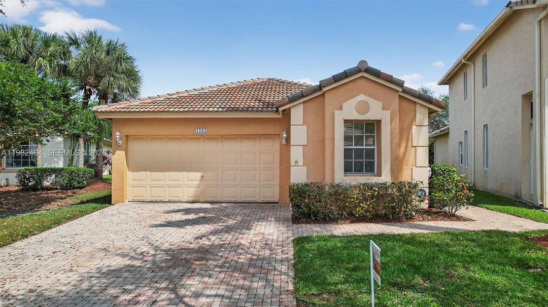 YOUR WAIT IS OVER.... RENOVATED 3 Bedroom ENORMOUS SUNROOM, 2 Bath, 2 Car Garage, Hibiscus Model Home in the Sought After Preserve at Pembroke Isles.