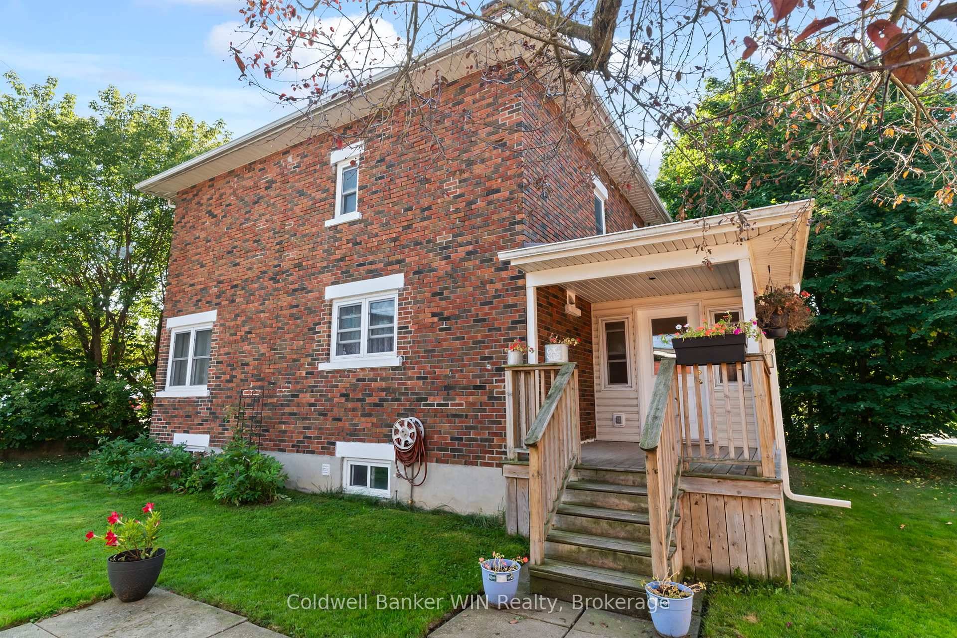 This 2 storey brick home in Mount Forest is unique in its Zoning.