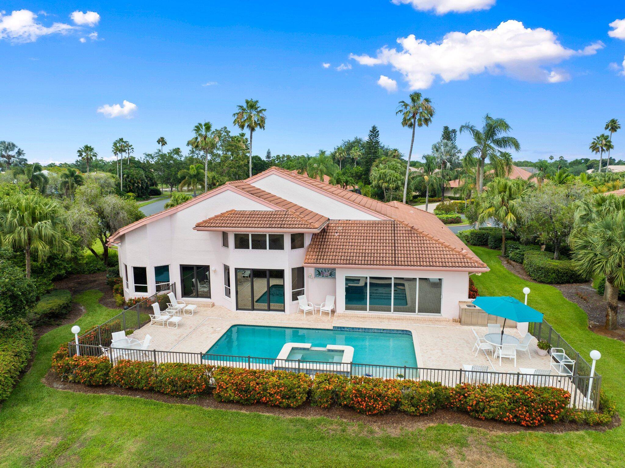 Enjoy natural light and serene views overlooking the lake, pool, and golf course from this beautifully maintained oasis in Piper's Landing Yacht Country Club.