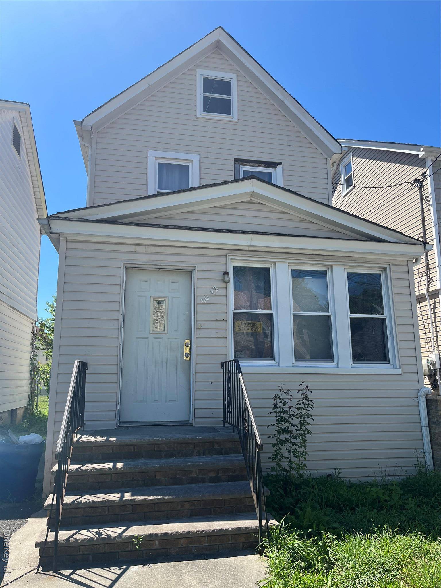 Fully detached legal 2 family with private driveway and garage.