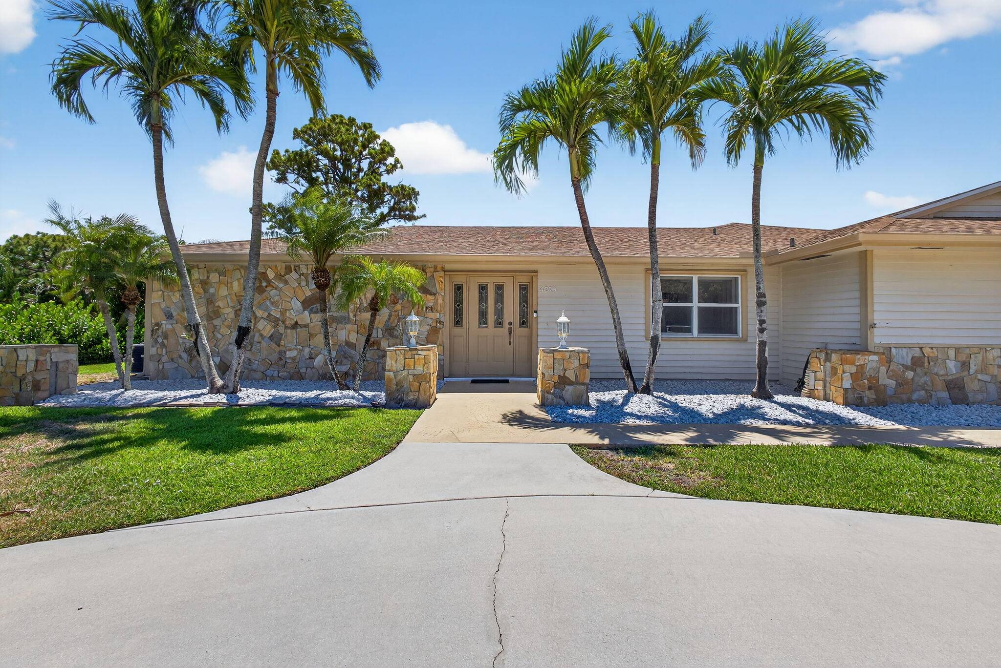 Spacious lakefront ranch home in a gated community with large, oversized rooms filled with abundant natural light The gourmet kitchen boasts granite counters and opens to a family room with ...