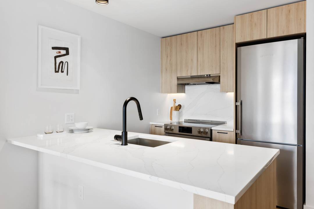 Beautiful one bedroom, one bathroom apartment front facing ; featuring oversized windows, matte black and Calcutta finishes, custom tiled bathrooms, spacious closets, and in unit washer dryer.