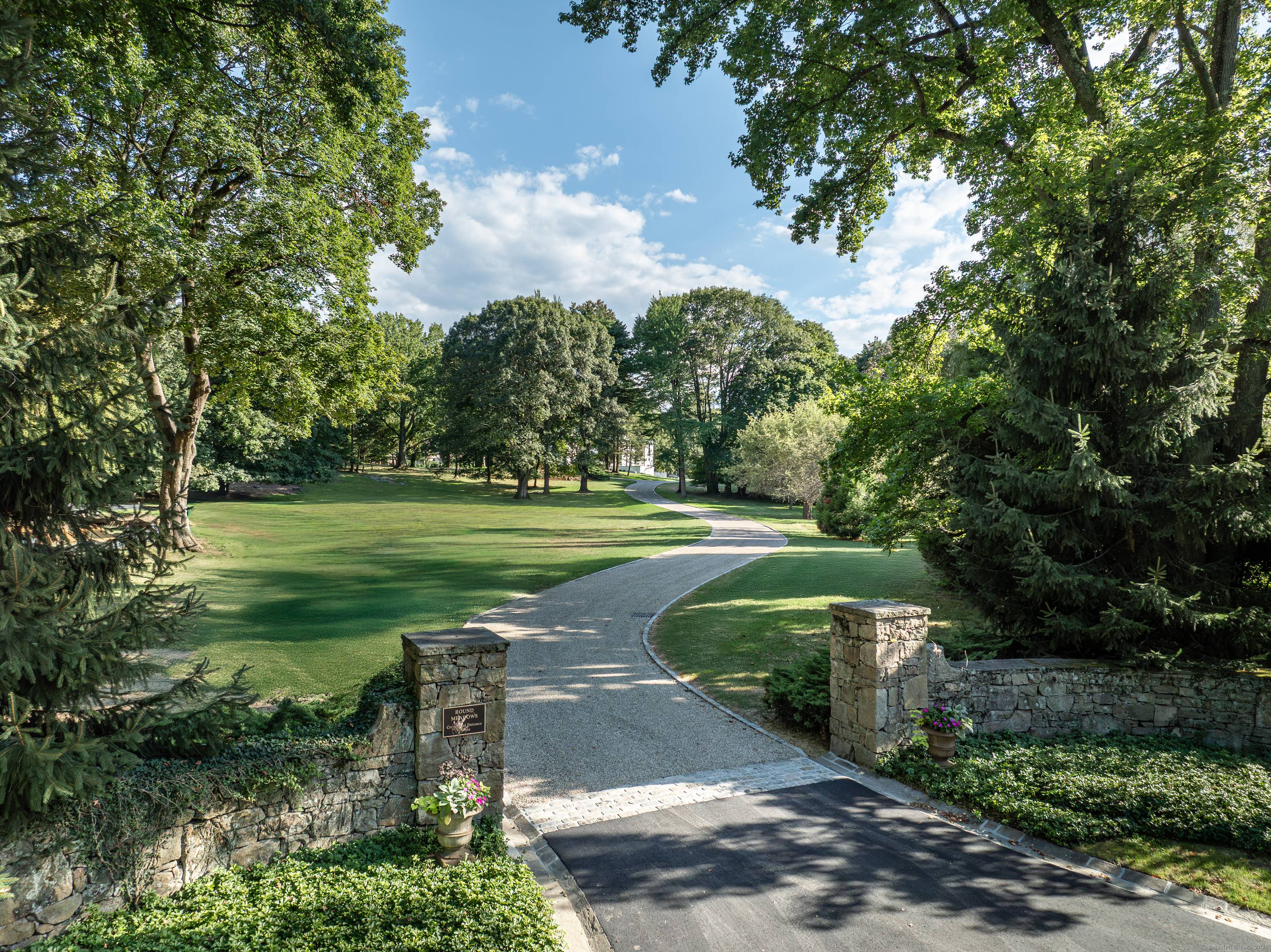 This magnificent Round Meadows estate with a fantastic 9700 sf house on 5.