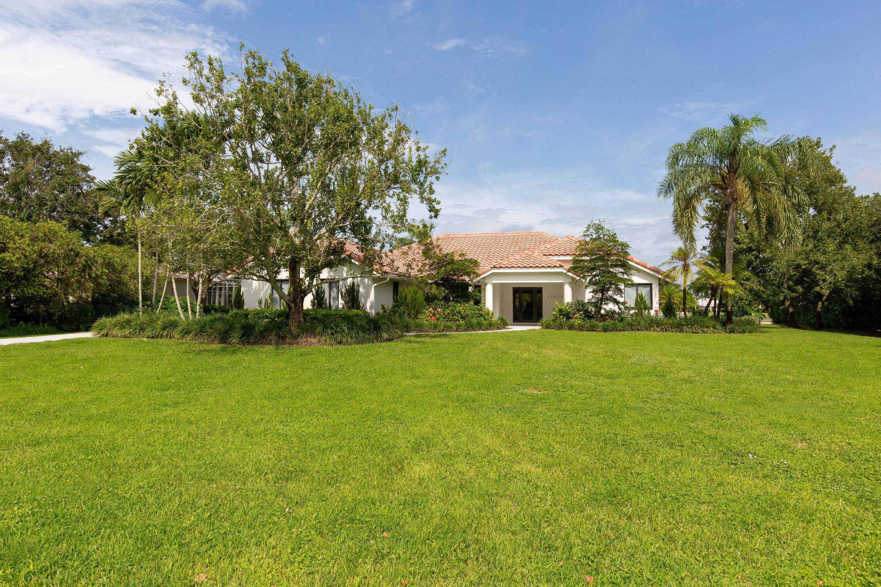 This gorgeous pool home is situated on a larger, 1.