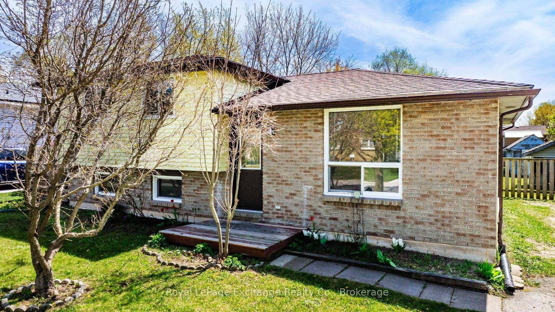 Totally renovated three level side split on oversized, fenced lot.