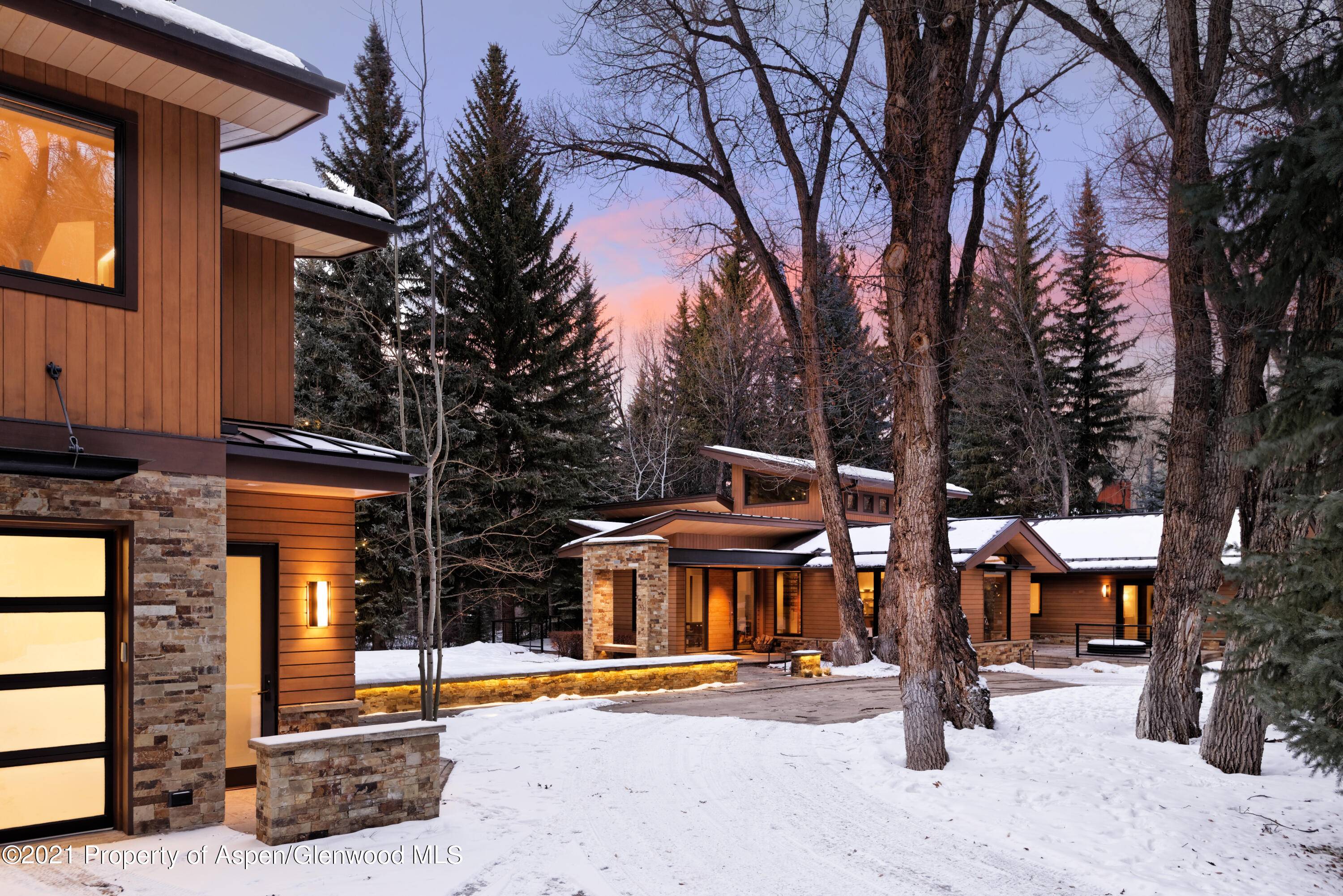 Nestled on a serene half acre lot, this contemporary custom home offers luxury, privacy, and convenience with a spa like feel.