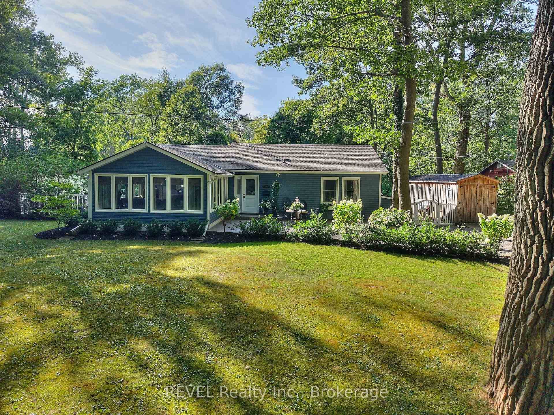 Discover the perfect blend of peaceful serenity and lakefront living in this stunning waterfront retreat on sought after Colony Road.