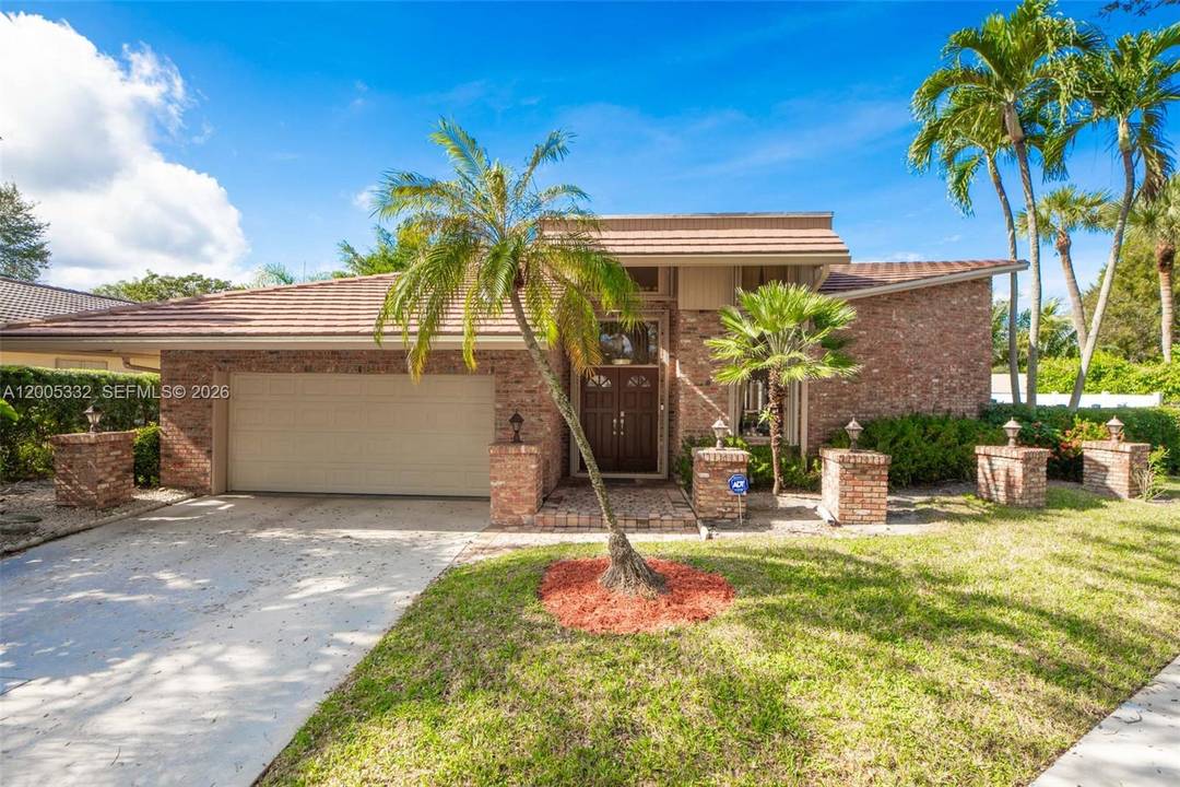 Experience elevated South Florida living in this stunning golf course home in the heart of Boca Raton.