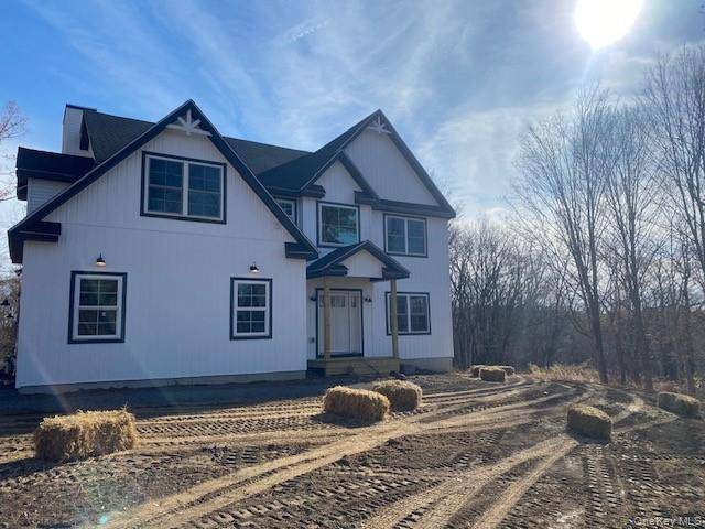 Welcome to The Oaklynn a stunning new construction Colonial nestled on 11 picturesque acres.