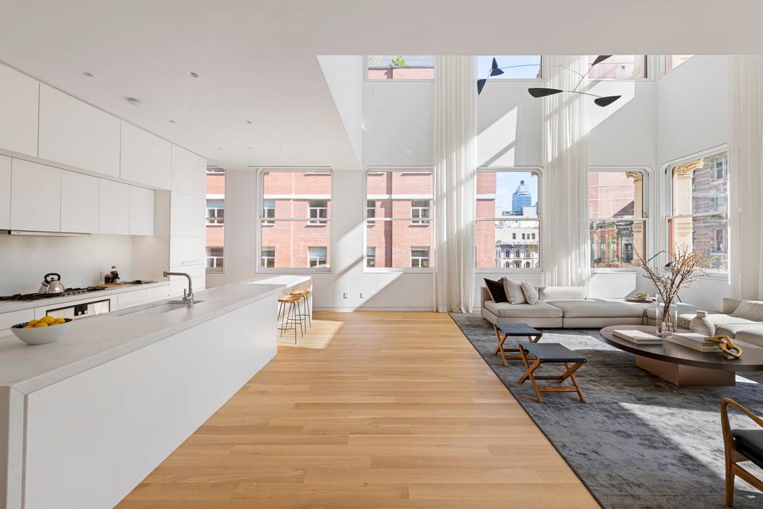 Designer Duplex Loft with 25 ft Ceilings in Restored Landmark New Development Introducing this one of a kind duplex condo situated in TriBeCa, steps from SoHo, a palatial 4 bedroom, ...