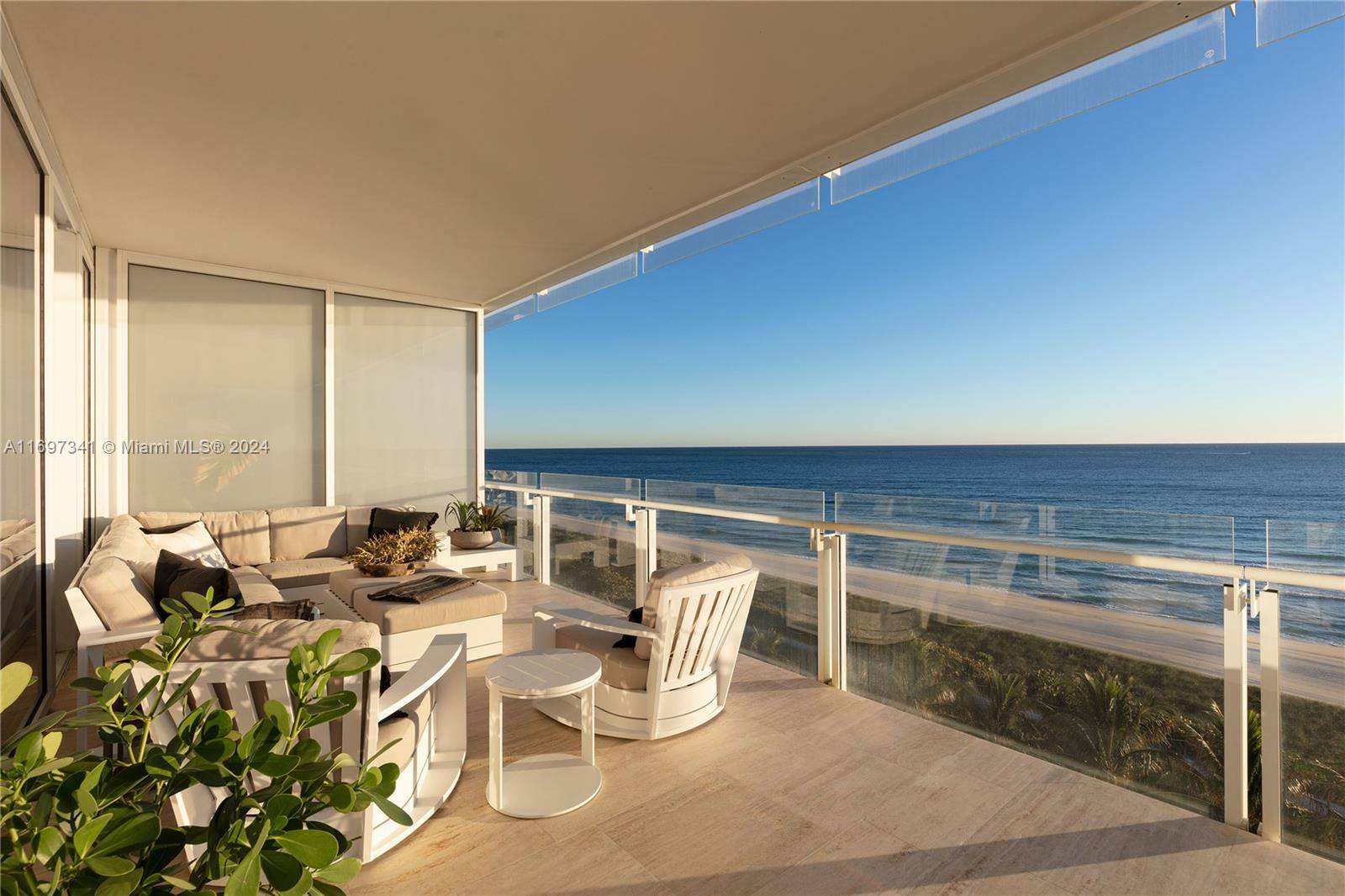Experience coastal luxury in this rare southeast corner unit with breathtaking ocean views and a peaceful tree line.