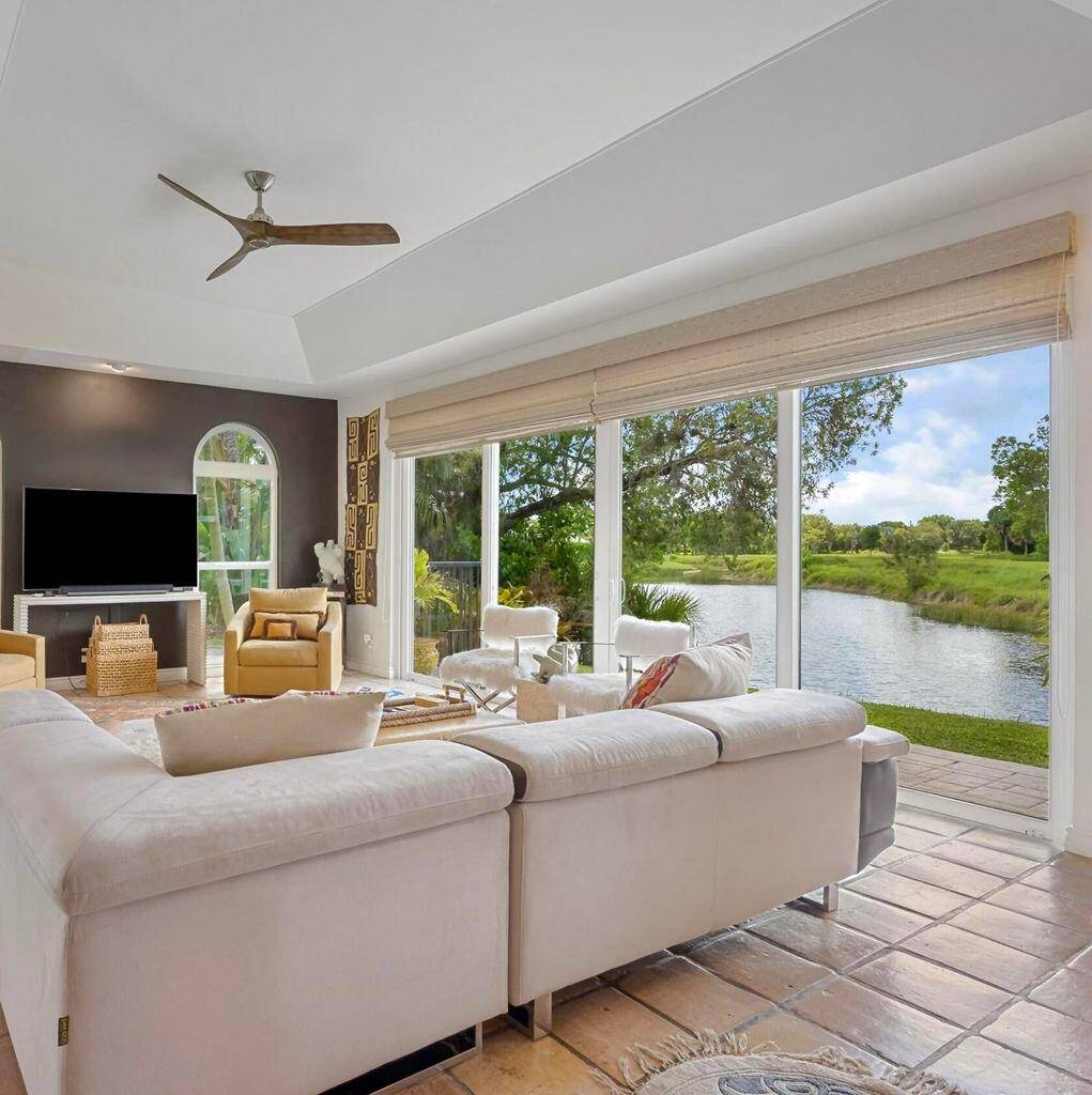 Private beyond compare, this rarely available first floor, end unit waterfront residence is discreetly positioned within one of Palm Beach Polo's most coveted and tranquil enclaves.