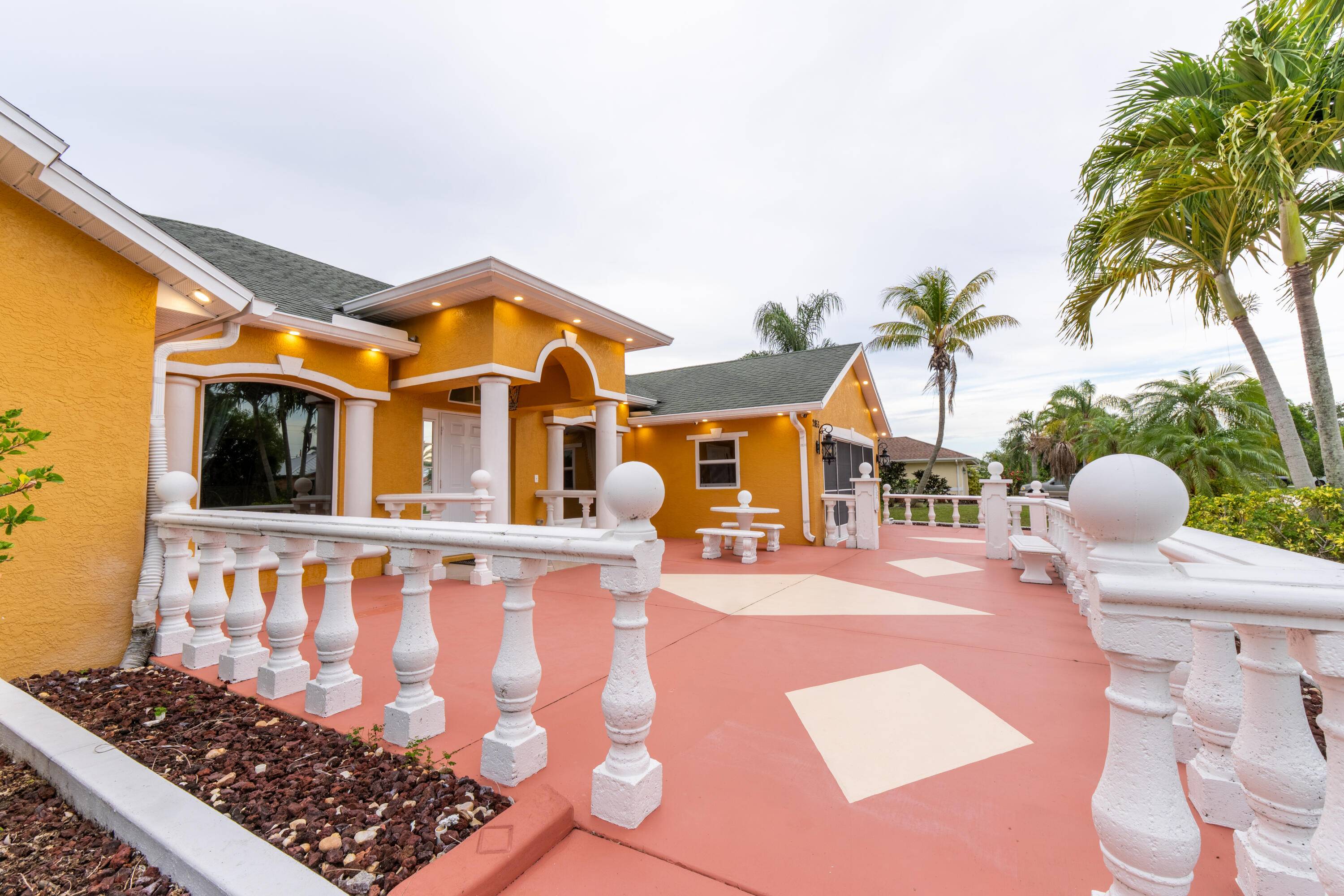 Luxury Coastal Living on 1 3 Acre with Dual Driveways Designer Touches.