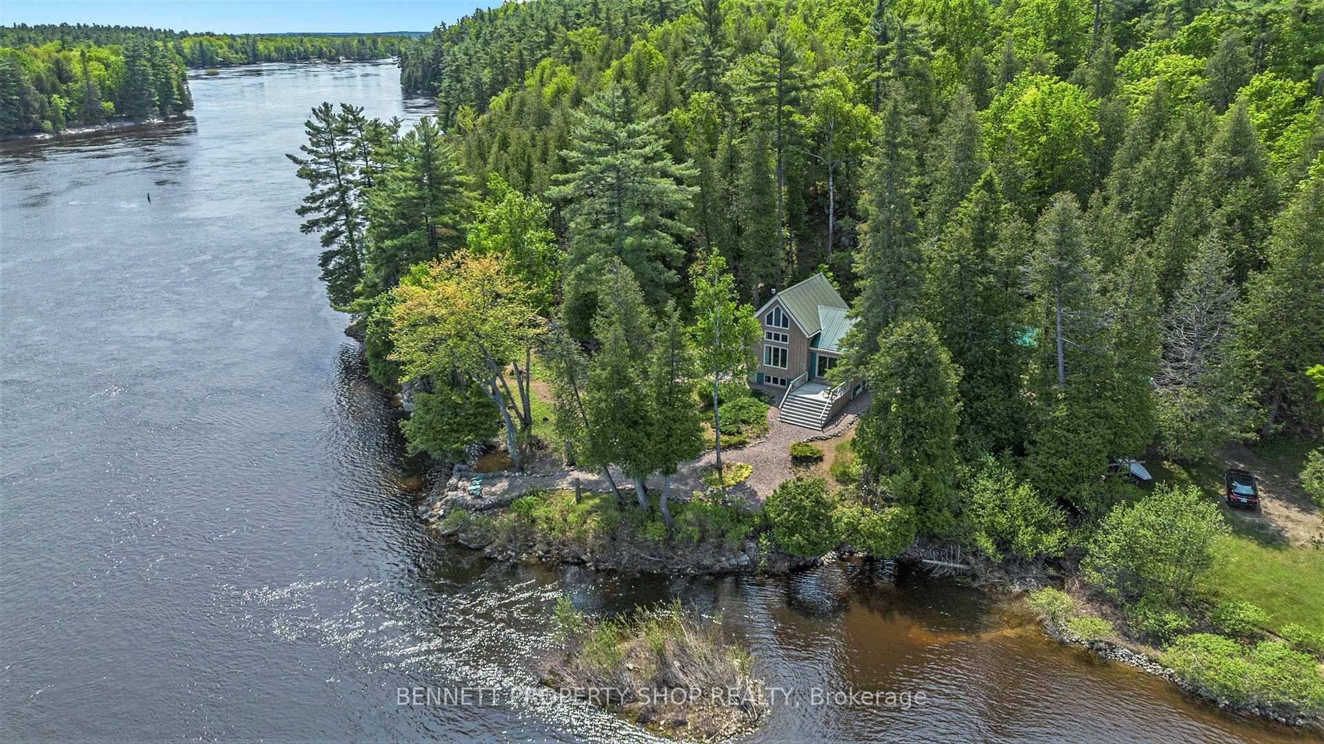 Idyllic Post and Beam Waterfront Cottage on the Ottawa River a fairytale like property nestled on 5.