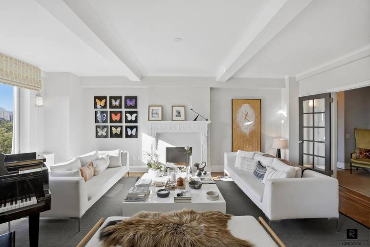 The windowed chef s kitchen is impeccably appointed with top of the line appliances by Wolf, Miele, and Sub Zero, custom cabinetry, and sophisticated finishes throughout, blending functionality with timeless ...