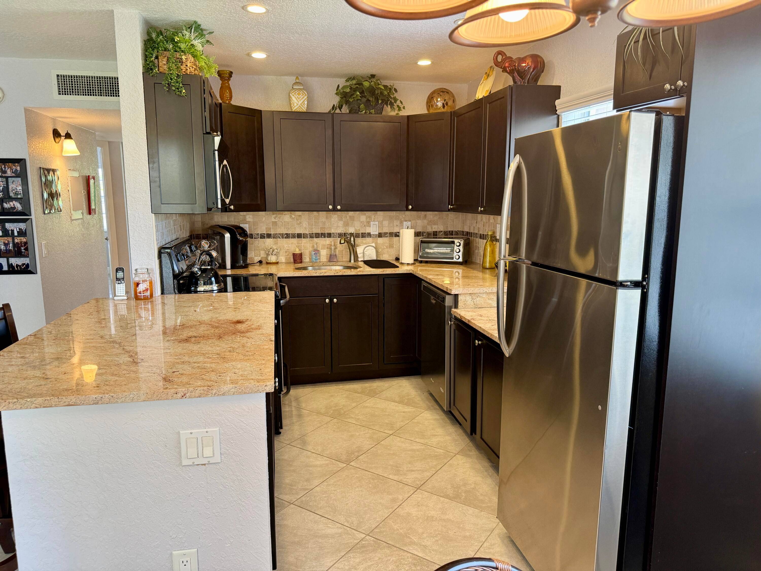 WOW ! REMODELED, CORNER, 2 BEDROOM, 2 BATH STYLISHLY FURNISHED CONDO WITH ALL MODERN TOUCHES.