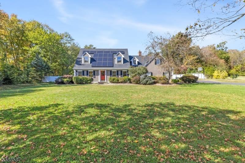 Welcome to this beautifully maintained custom Cape Cod home, featuring 4 spacious bedrooms, 3 full bathrooms, and a 3 car garage.