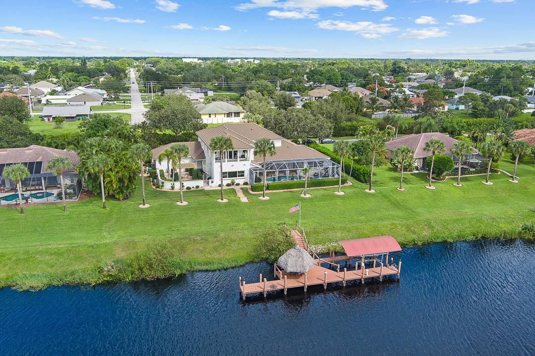 Welcome to your own private paradise in the heart of Port Saint Lucie, Florida, a stunning custom Mediterranean style estate that embodies the essence of luxury coastal living.