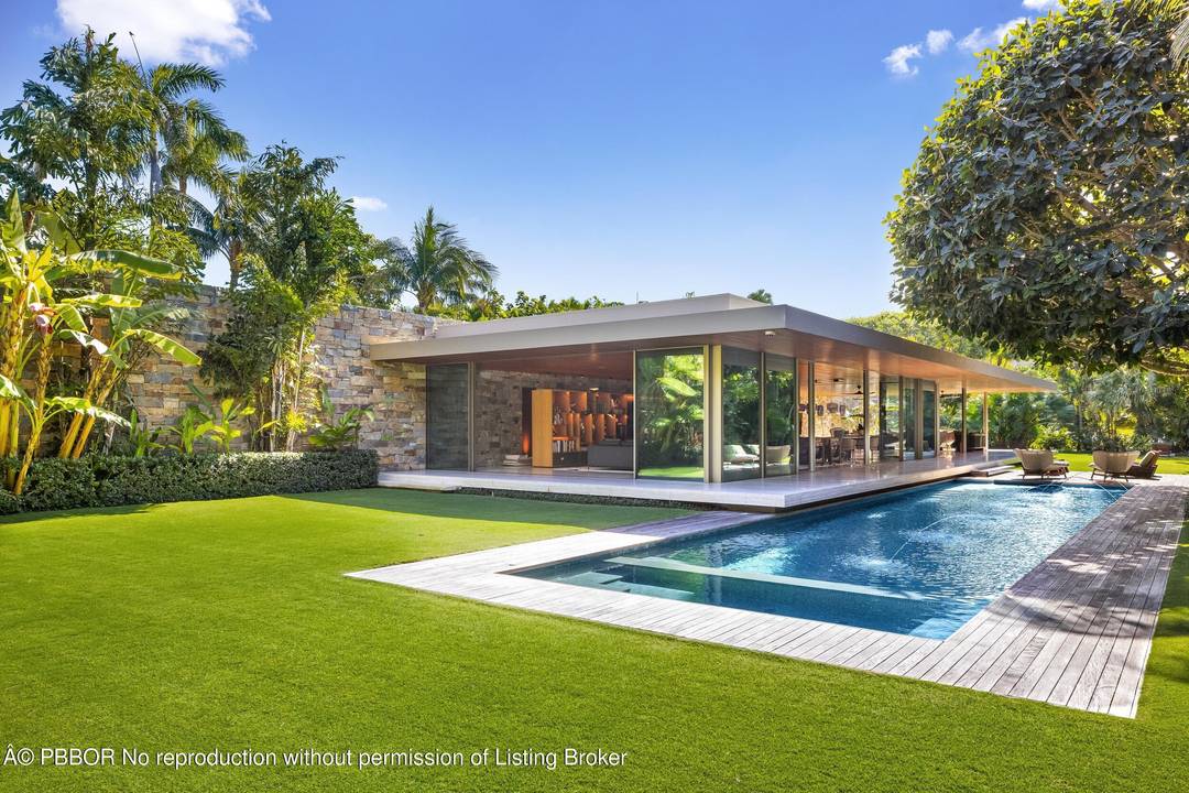 A stunning modern estate set on a rare, oversized 40, 000 square foot lot, this exceptional one story residence is a masterwork by award winning modernist architect Marcio Kogan of ...