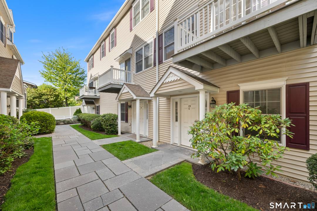 Experience luxurious, carefree living in this immaculate tri level townhouse, located less than a mile from the heart of town.