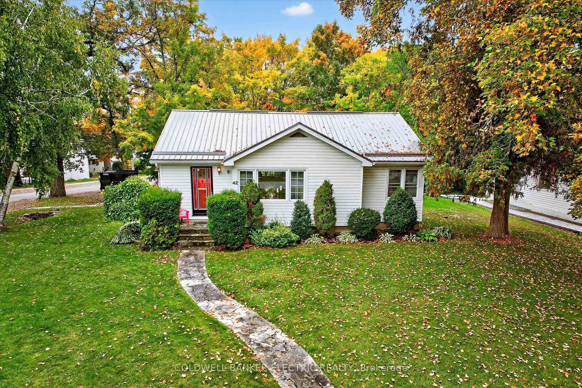 Nestled in a serene, water adjacent community, this charming bungalow sits on a generous corner lot of approximately 95 feet by 170 feet.