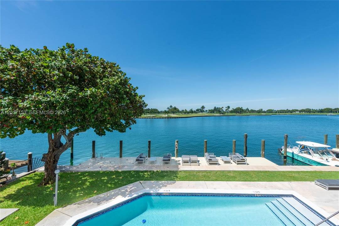 Beautifully updated waterfront corner condo in the heart of Bay Harbor Islands that feels like you are living in a waterfront home.