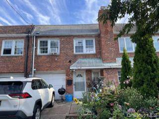 Bright 2 Family Attached Brick Home This well maintained property offers both comfort and investment potential.