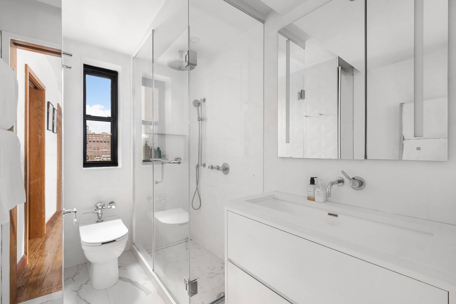 Nestled within one of Chelsea's most distinguished Emory Roth designed cooperatives, this high floor, fully renovated two bedroom, two bath home blends timeless pre war character with thoughtful modern updates.