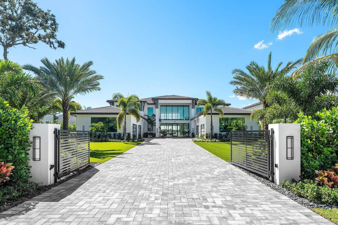 Experience unmatched luxury on the Loxahatchee River with this new waterfront estate offering panoramic blue water views.
