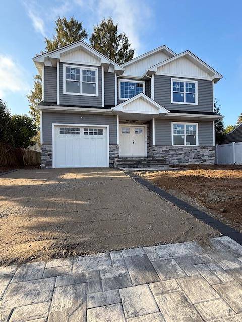 Nestled in the heart of Syosset, this brand new construction single family residence at 7 Greenway Circle offers a harmonious blend of elegance and modern comfort.